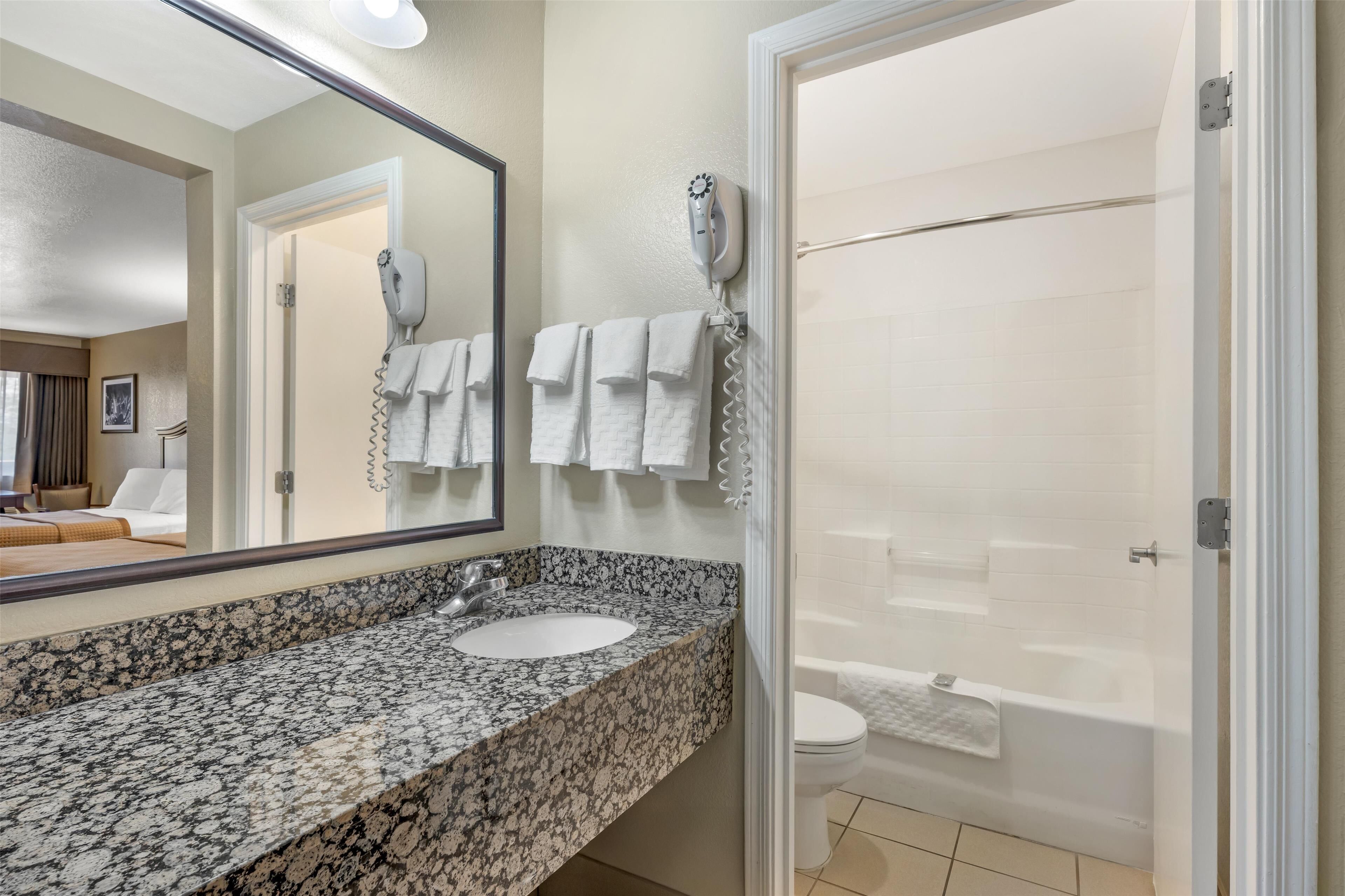 standard room, 2 queen beds, non smoking, microwave | bathroom | free toiletries, hair dryer, towels, soap