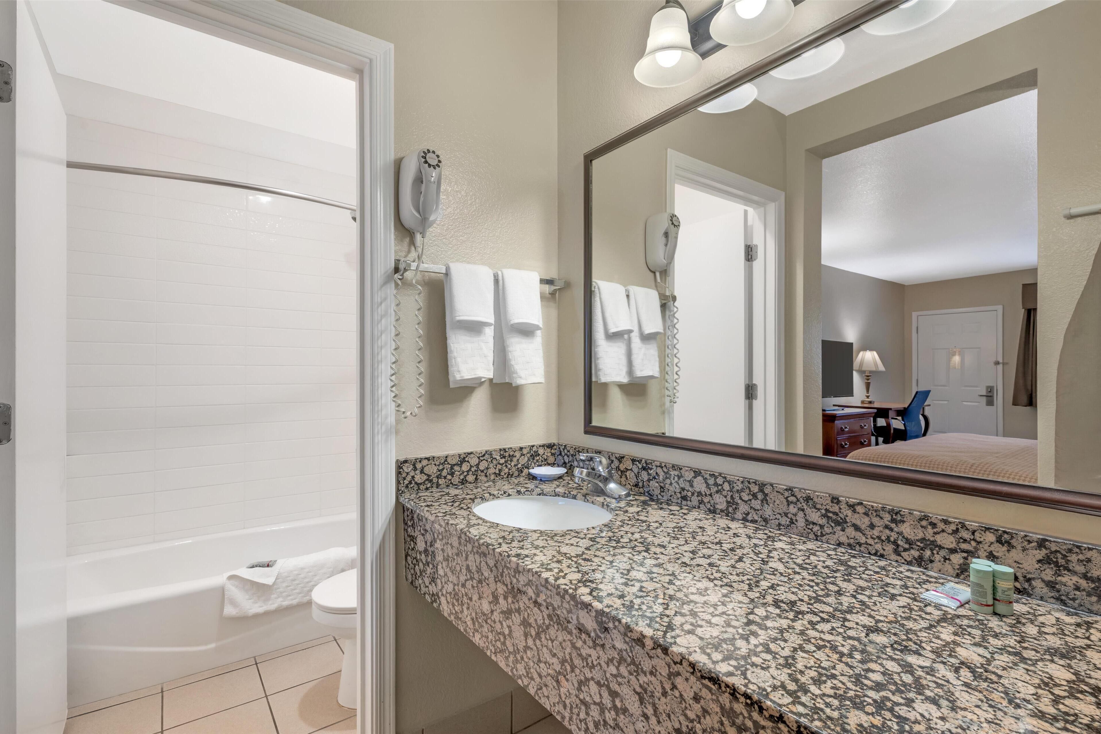 standard room, 1 king bed, non smoking, refrigerator & microwave (with sofabed) | bathroom | free toiletries, hair dryer, towels, soap