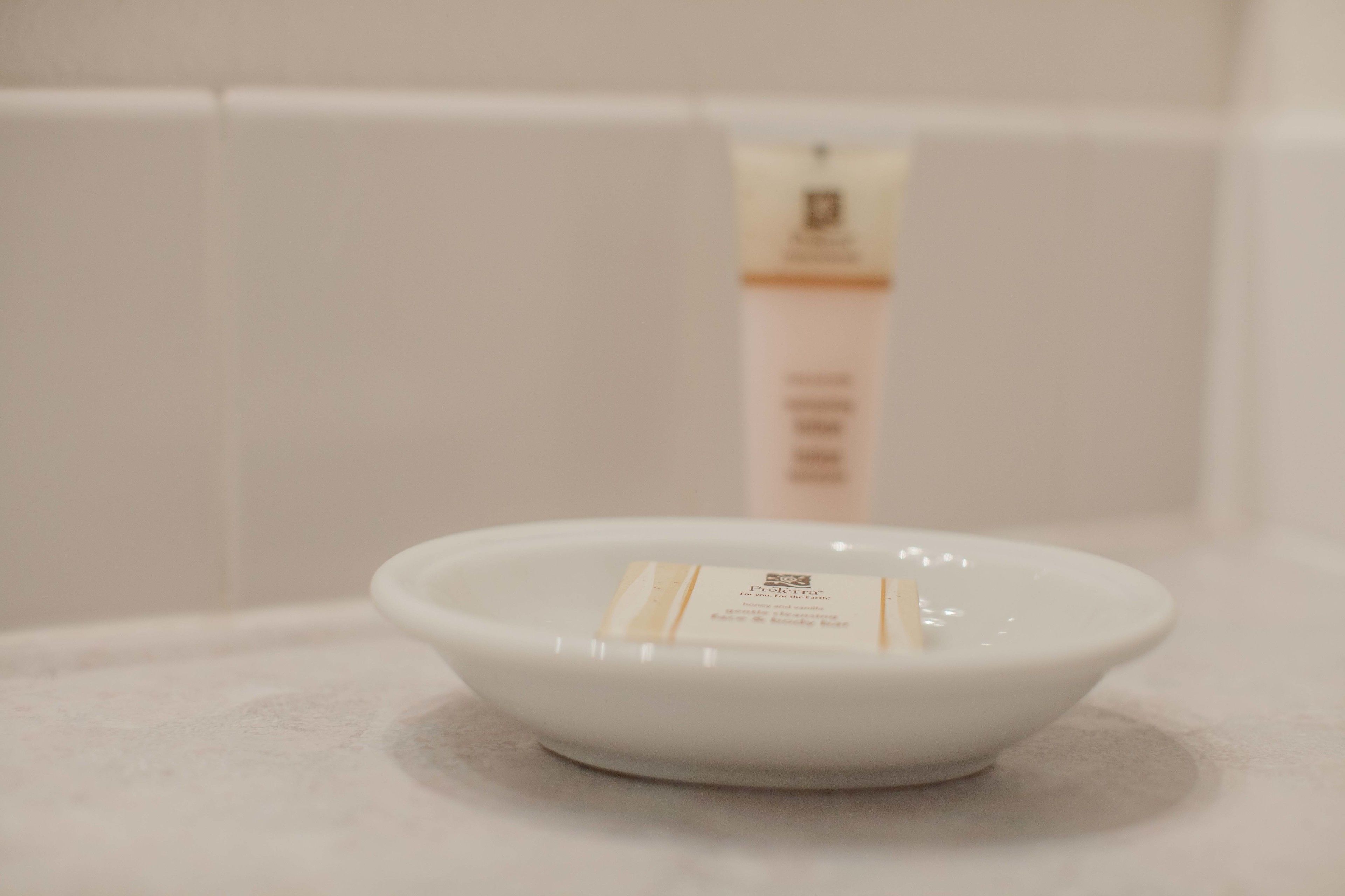 cottage, 2 queen beds, garden area | bathroom amenities | combined shower/bathtub, free toiletries, hair dryer, towels