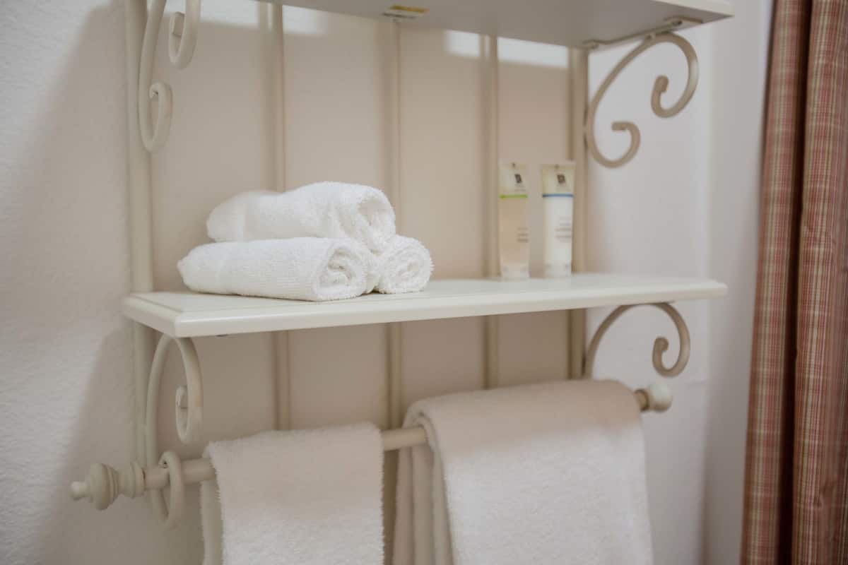 cottage, 2 queen beds, garden area | bathroom amenities | combined shower/bathtub, free toiletries, hair dryer, towels