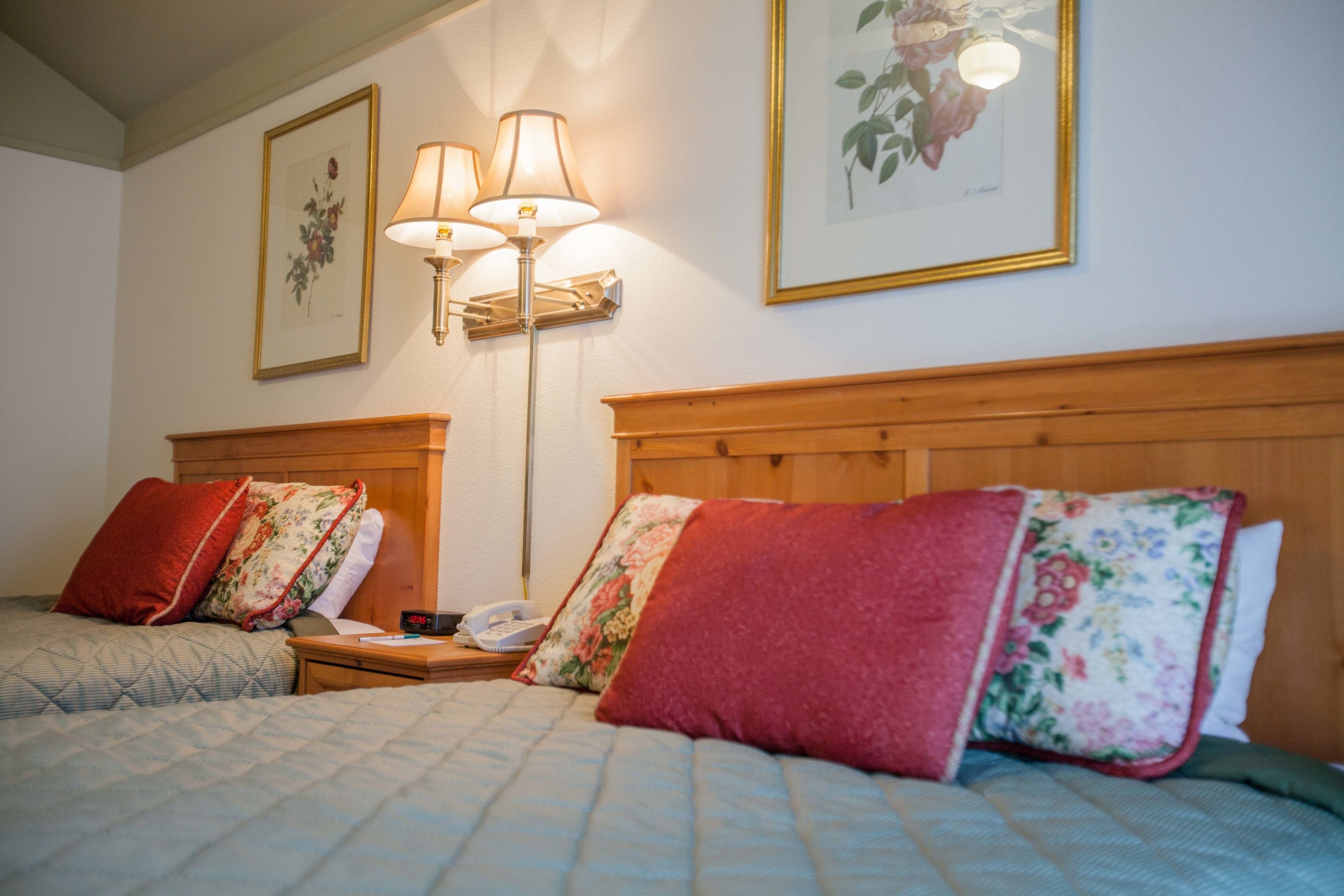 cottage, 2 queen beds, garden area | desk, blackout curtains, iron/ironing board, free wifi