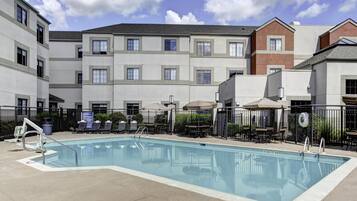 Seasonal outdoor pool, open 10:00 AM to 10:00 PM, pool umbrellas