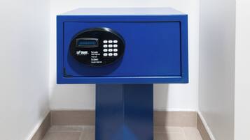 A blue safe with a digital keypad and instructions for locking and opening.