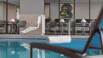 Indoor pool, open 7:00 AM to 11:00 PM, pool loungers