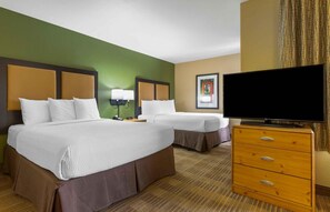 A hotel room with two beds, a television, a dresser, and a framed picture on the wall. - Extended Stay America Suites Phoenix Scottsdale (Scottsdale)