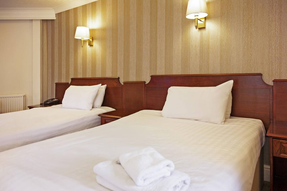 Hypo-allergenic bedding, desk, laptop workspace, iron/ironing board