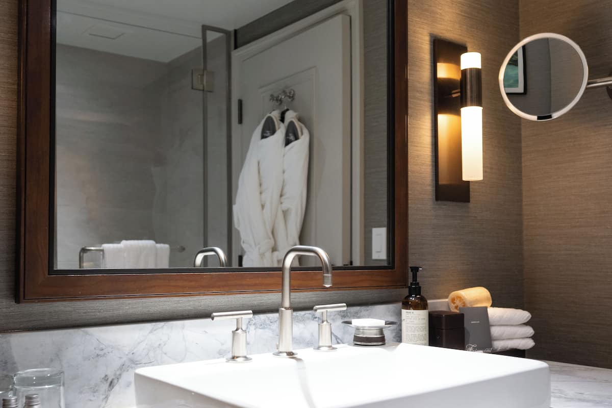 designer toiletries, hair dryer, bathrobes, towels