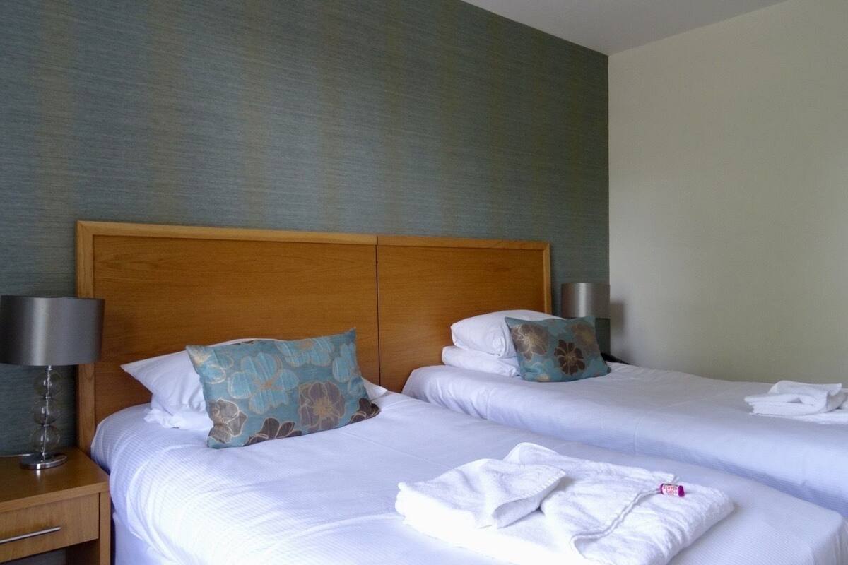 Family Room | Iron/ironing board, WiFi (free), alarm clocks