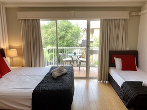 Superior Triple Room, 1 Bedroom | 1 bedroom, individually decorated, individually furnished, desk