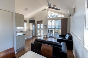 2 Bedroom Waterfront Villa | Living area | Flat-screen TV