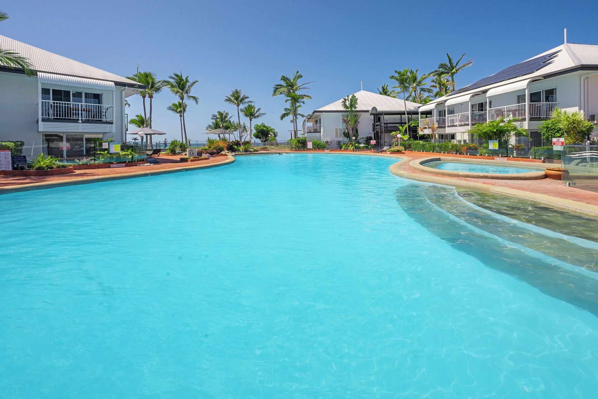 3 outdoor pools, open 8:00 AM to 9:00 PM, pool umbrellas, pool loungers