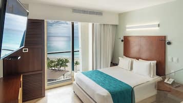 Habitación Deluxe, vista al océano | Artículos del minibar gratis y caja de seguridad en la habitación