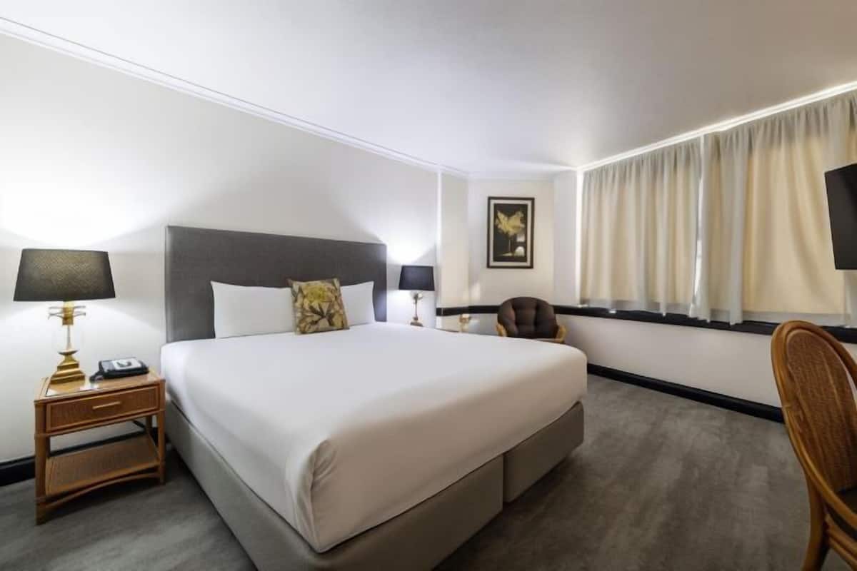 Premium bedding, desk, laptop workspace, iron/ironing board