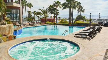 Indoor pool, 2 outdoor pools, open 10:00 AM to 9:00 PM, pool umbrellas