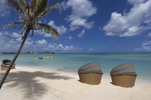 On the beach, free beach cabanas, beach umbrellas, beach towels