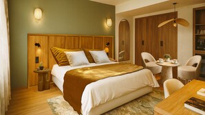 A modern hotel room with a large bed, wooden headboard, two bedside tables, a round coffee table, and a dining table with chairs. - Hotel de l'Horloge (Avignon)