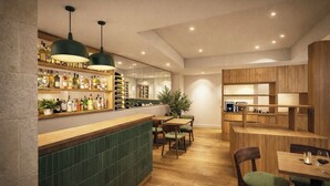 A modern bar area with wooden shelves, green-tiled bar counter, and pendant lighting. - Hotel de l'Horloge (Avignon)
