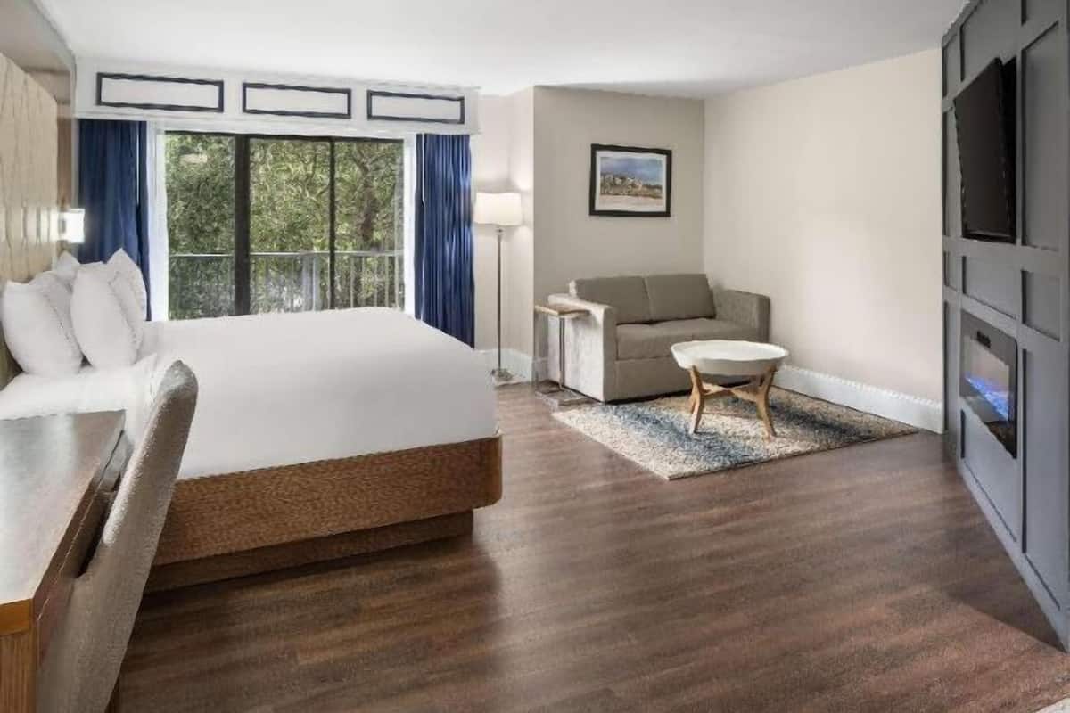 Premium bedding, desk, laptop workspace, blackout drapes