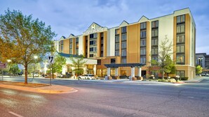 A multi-story hotel with a modern design, featuring a prominent entrance with a covered walkway and a sign that reads "HYATT PLACE".