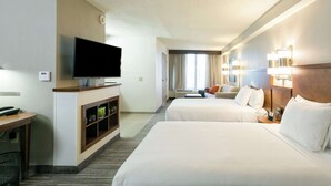 A hotel room with two beds, a TV, a desk with a computer, and a minibar. - Hyatt Place Nashville/Franklin/Cool Springs (Franklin)