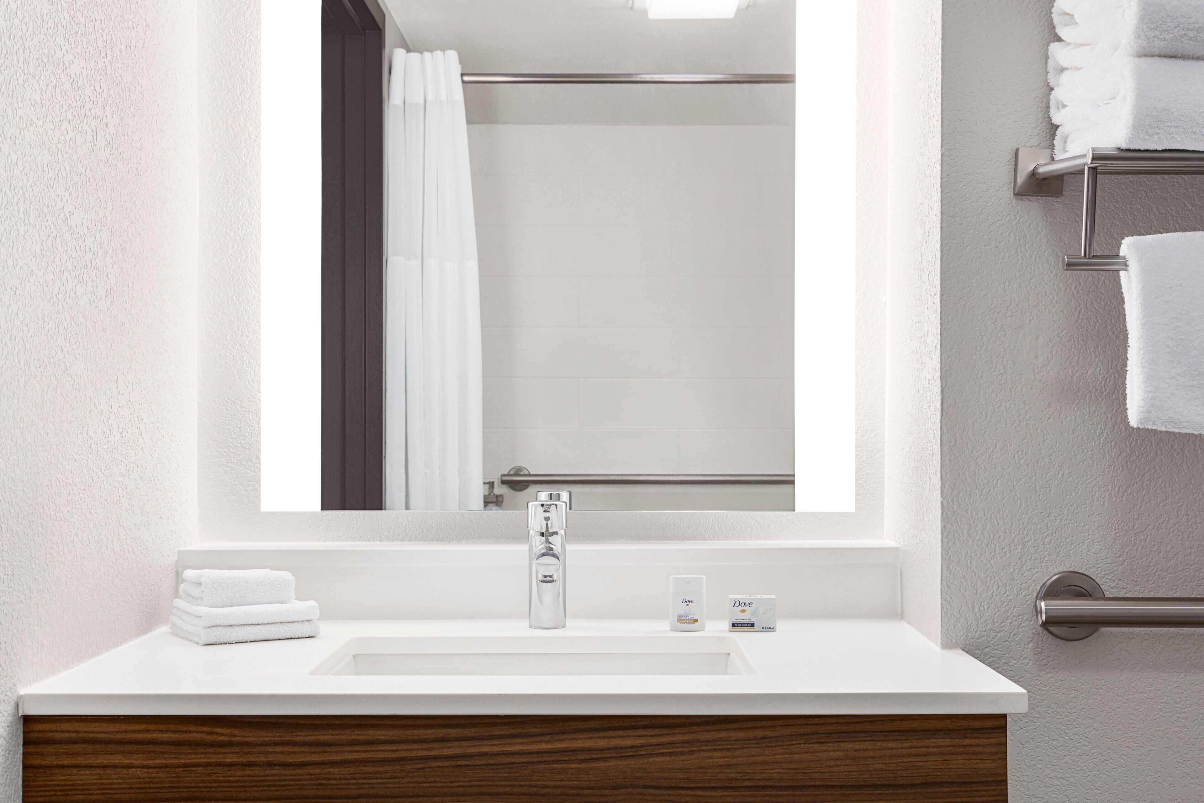 combined shower/bathtub, deep-soaking bathtub, hair dryer, towels