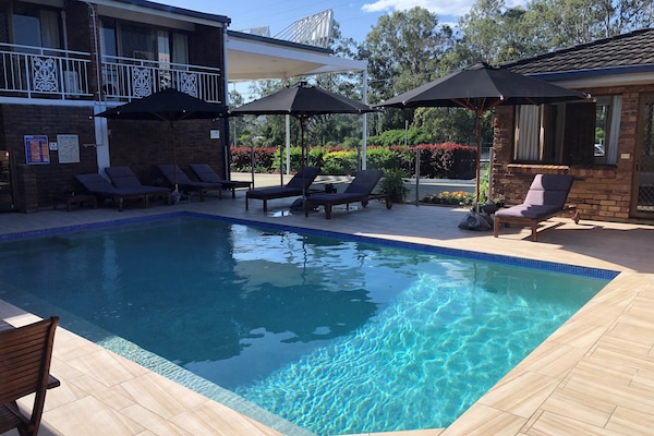 Outdoor pool, open 9:00 AM to 7:00 PM, pool umbrellas, pool loungers