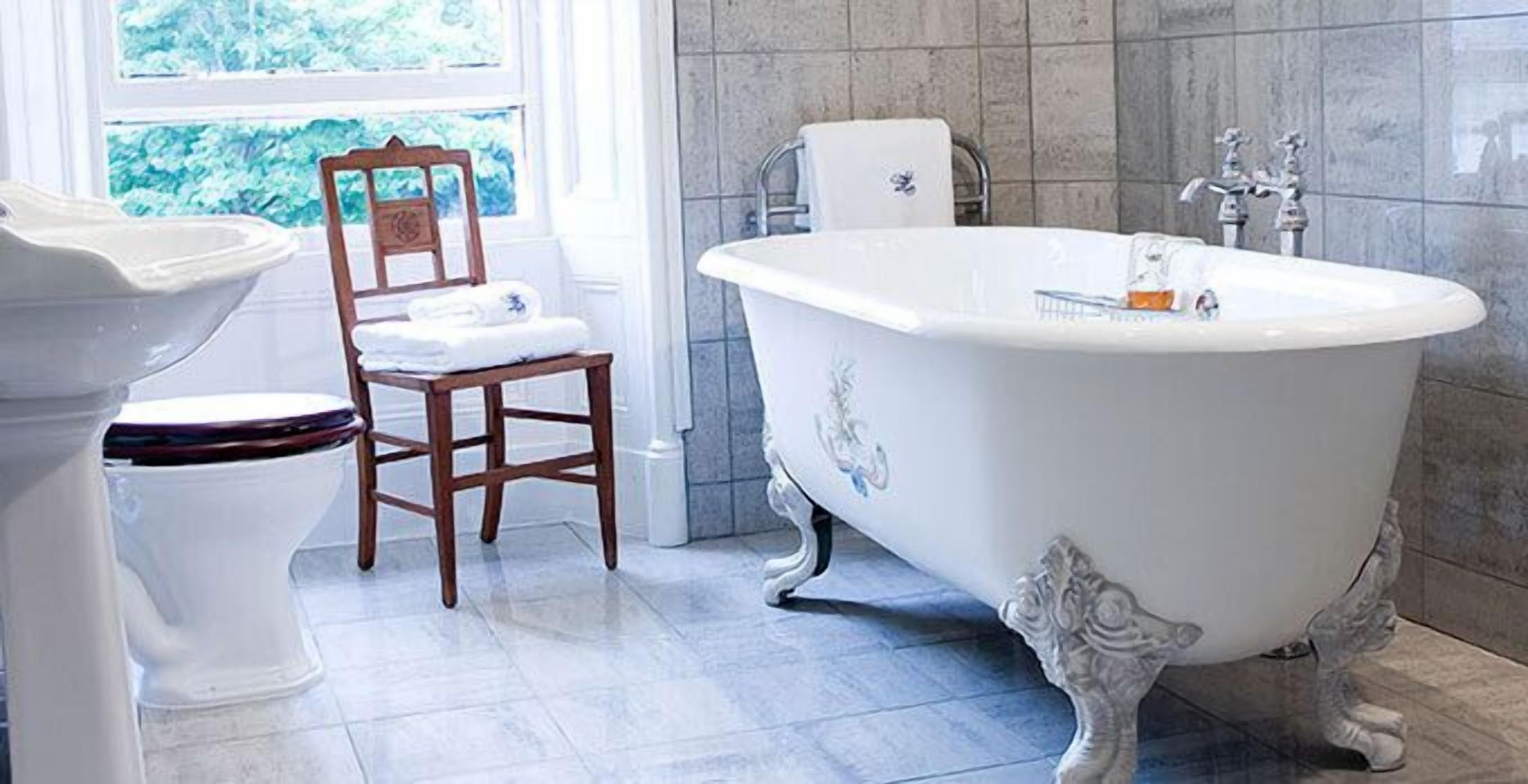 master room | bathroom | combined shower/bathtub, designer toiletries, hair dryer, bathrobes