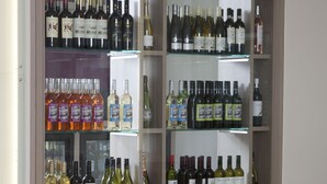 A wine cellar with various bottles and glasses. - Sudbury House Hotel (Faringdon)