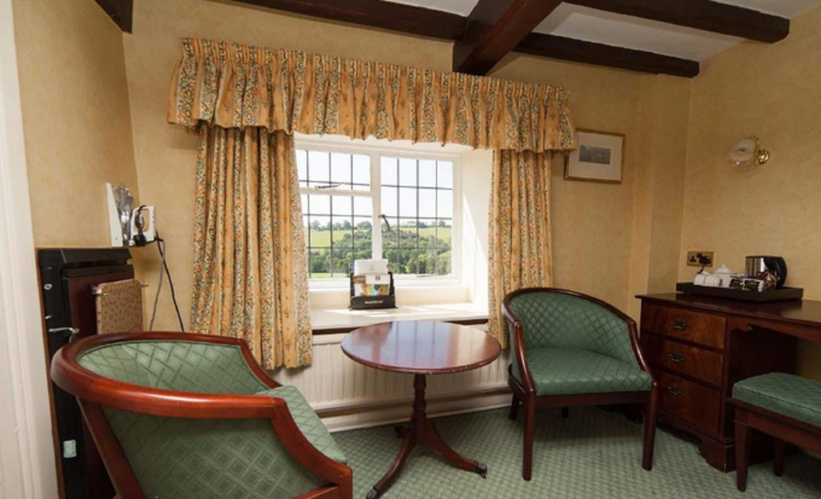 classic double room, garden view | in-room safe, individually decorated, individually furnished, desk