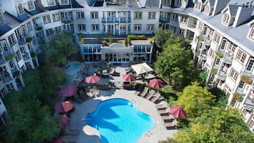 Seasonal outdoor pool, pool umbrellas, lifeguards on site