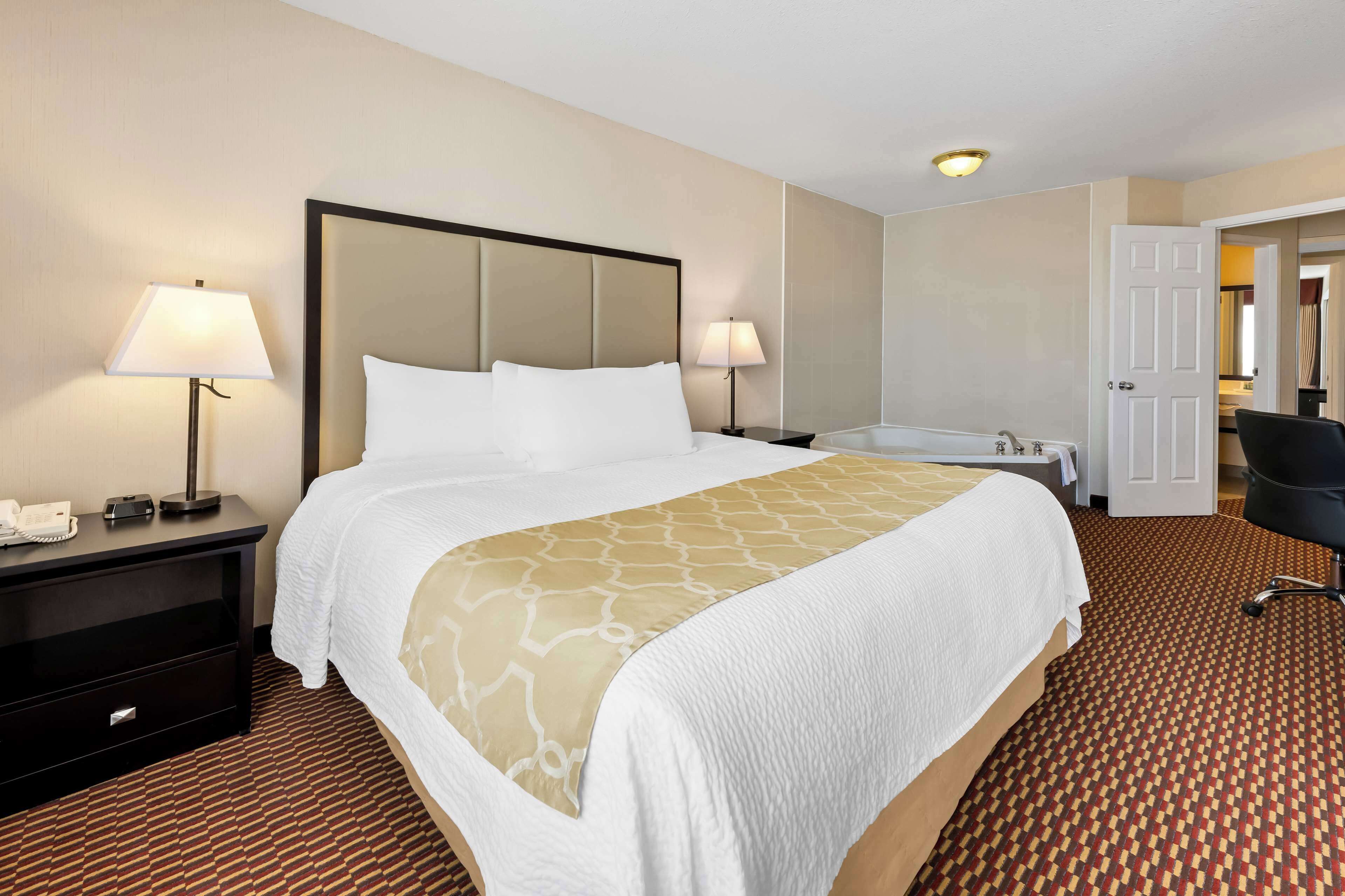 suite, 1 king bed, non smoking, jetted tub | desk, laptop workspace, iron/ironing board, free wifi