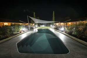 A swimming pool with a white canopy, surrounded by a fence and illuminated by lights. - Best Western Plus All Settlers Motor Inn (South Tamworth)