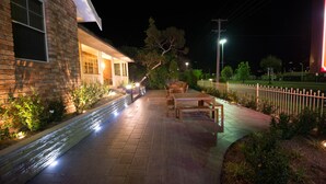 A brick building with a covered porch, a paved walkway, and outdoor seating. - Best Western Plus All Settlers Motor Inn (South Tamworth)