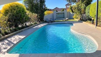 Outdoor pool, open 7:00 AM to 9:00 PM, pool umbrellas, pool loungers