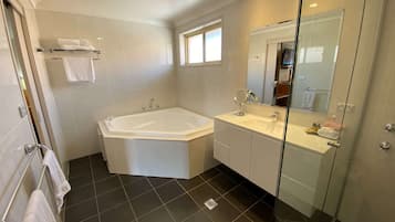 Separate bathtub and shower, free toiletries, hair dryer, bathrobes