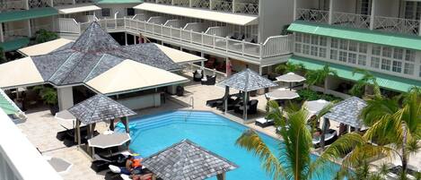 Outdoor pool, pool umbrellas, sun loungers