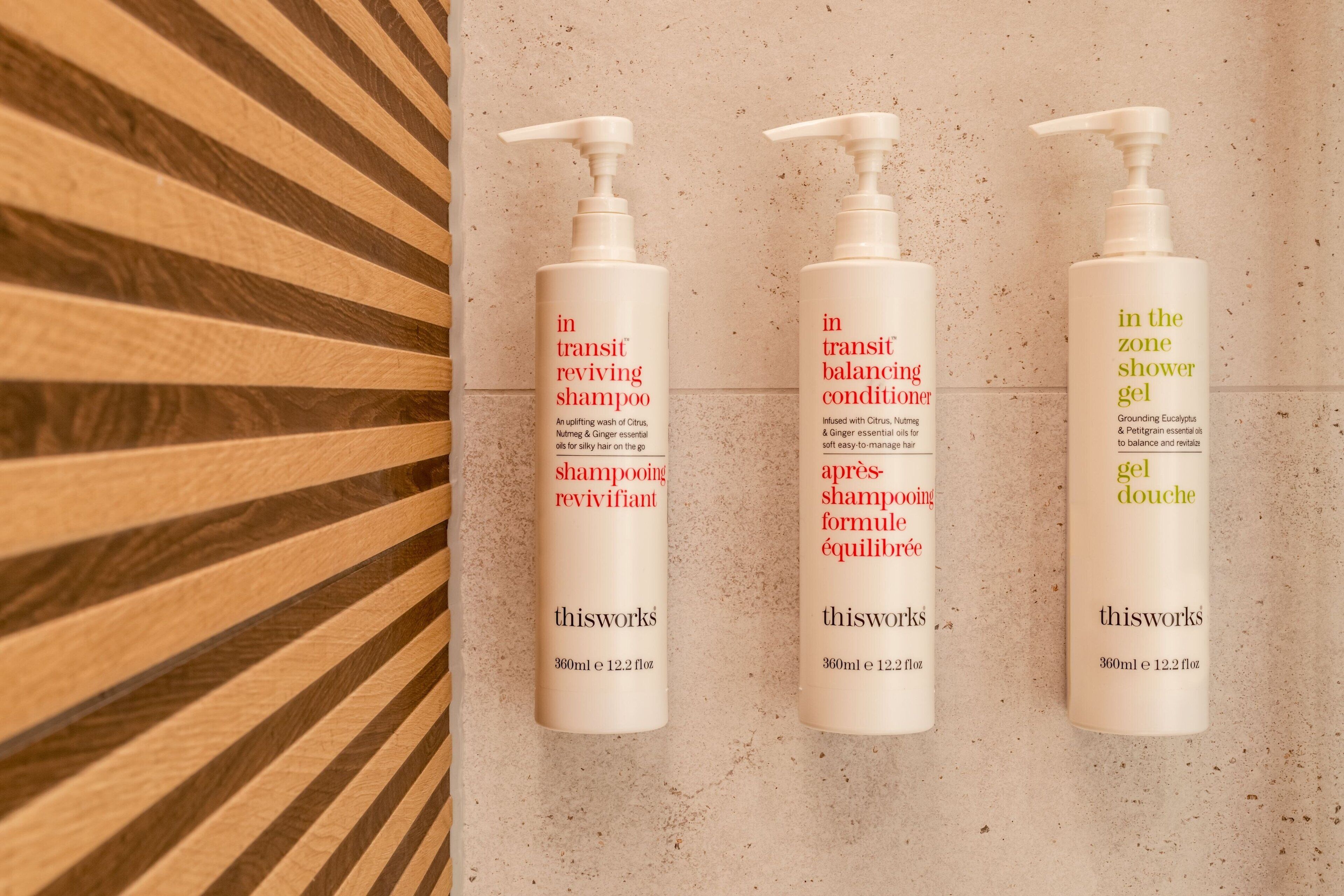 designer toiletries, hair dryer, bathrobes, slippers