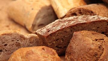 Slices of bread with a crusty exterior and a dense interior.
