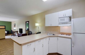 Full-sized fridge, microwave, stovetop, coffee/tea maker