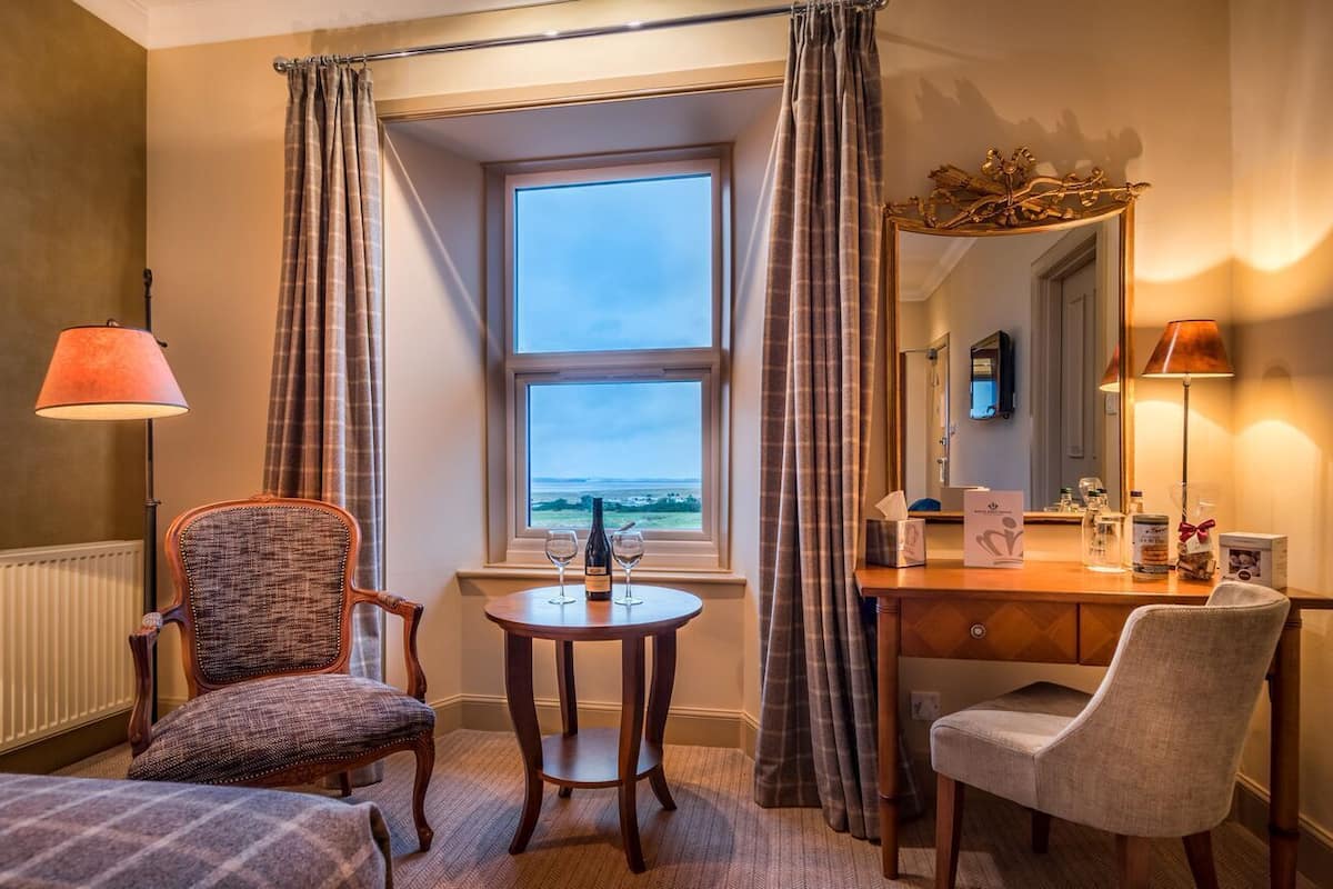 superior double guest room | premium bedding, desk, blackout curtains, iron/ironing board