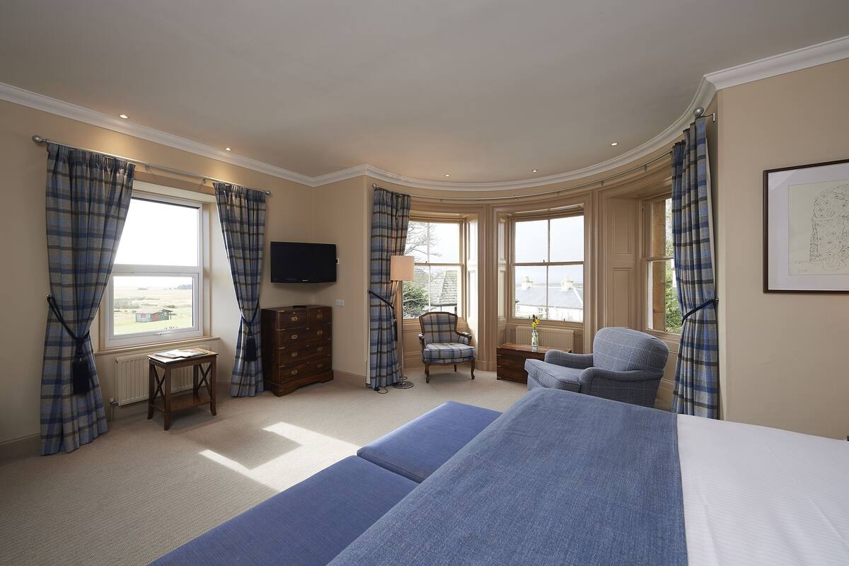 premium bedding, desk, blackout curtains, iron/ironing board