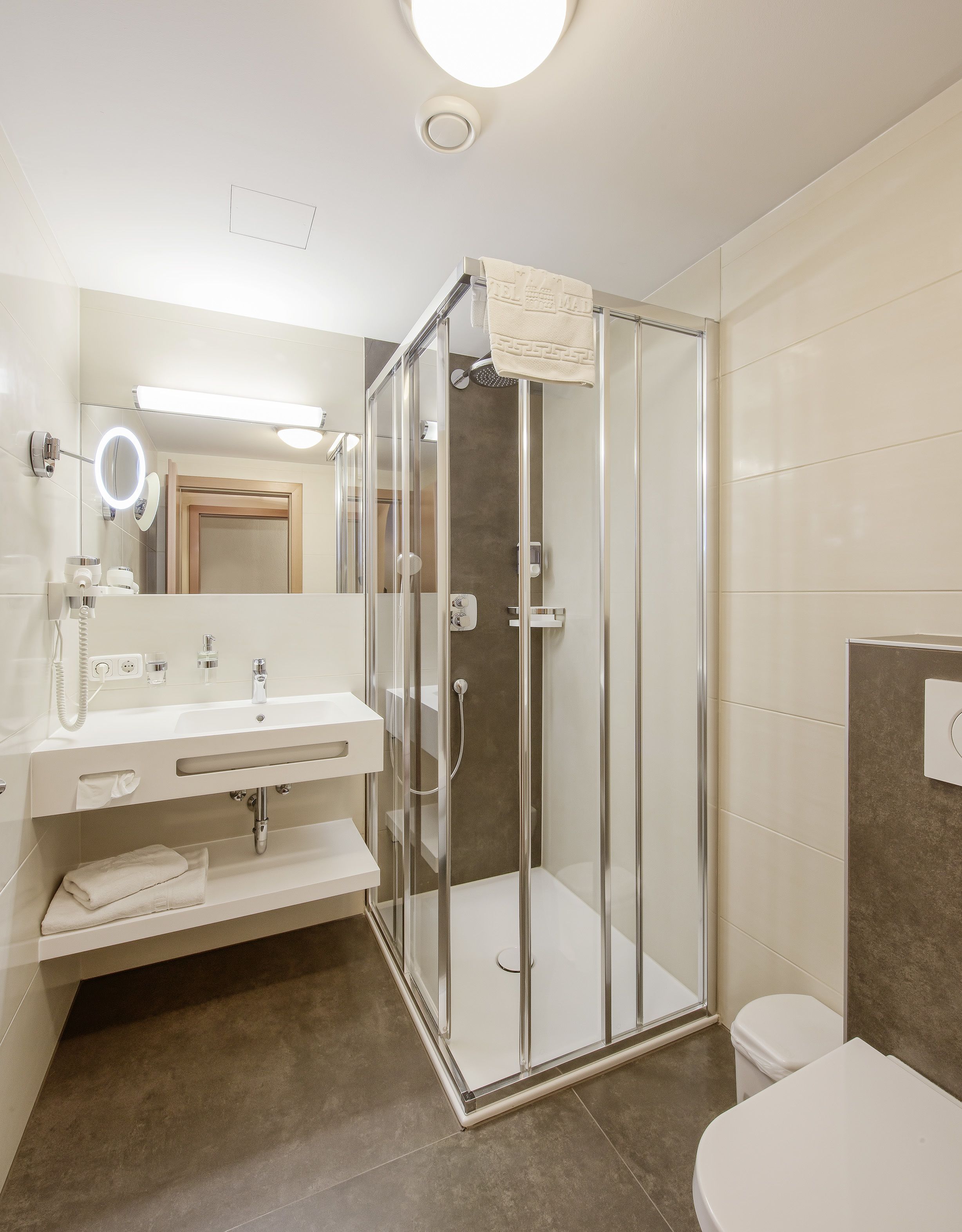 superior double room | bathroom | hair dryer, towels