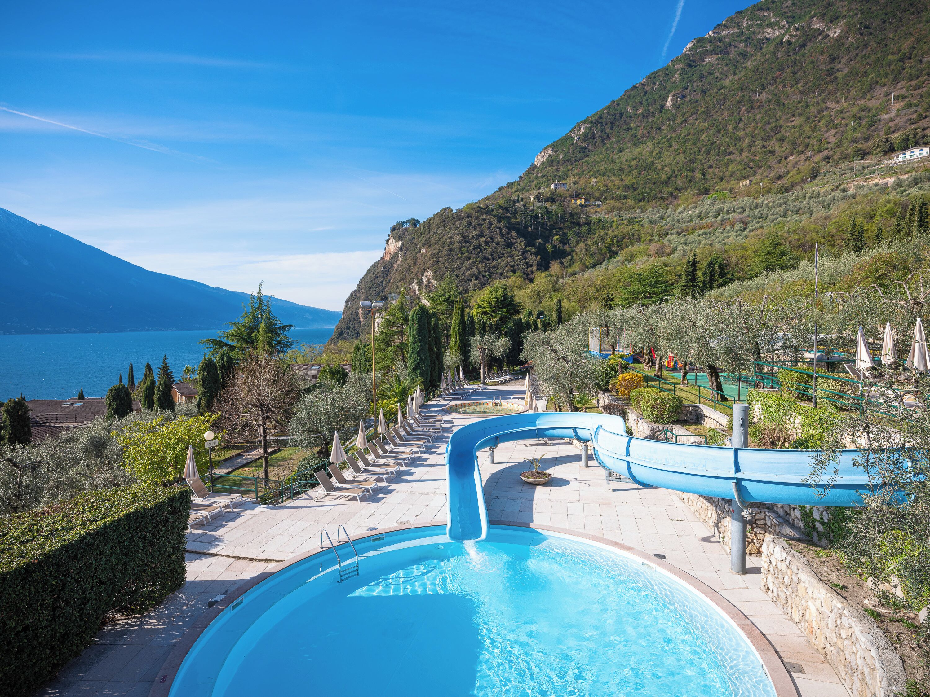 Indoor pool, seasonal outdoor pool, pool umbrellas, pool loungers
