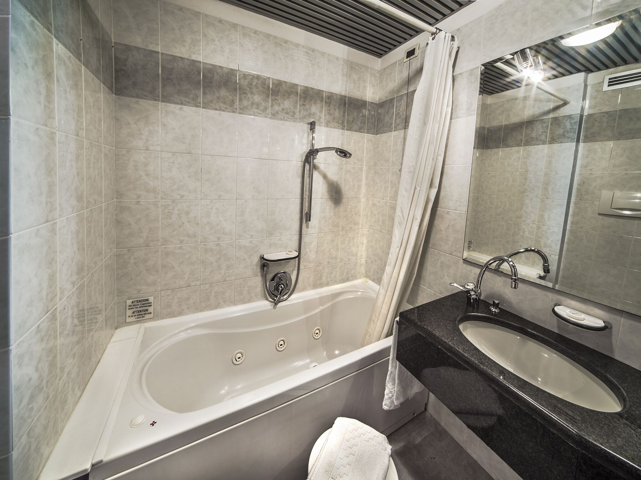 standard twin room | bathroom | shower, hair dryer, bidet, towels