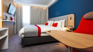 A modern hotel room with a bed, a desk, a TV, and a red chair. - Holiday Inn Express Burton Upon Trent by IHG (Burton on Trent)