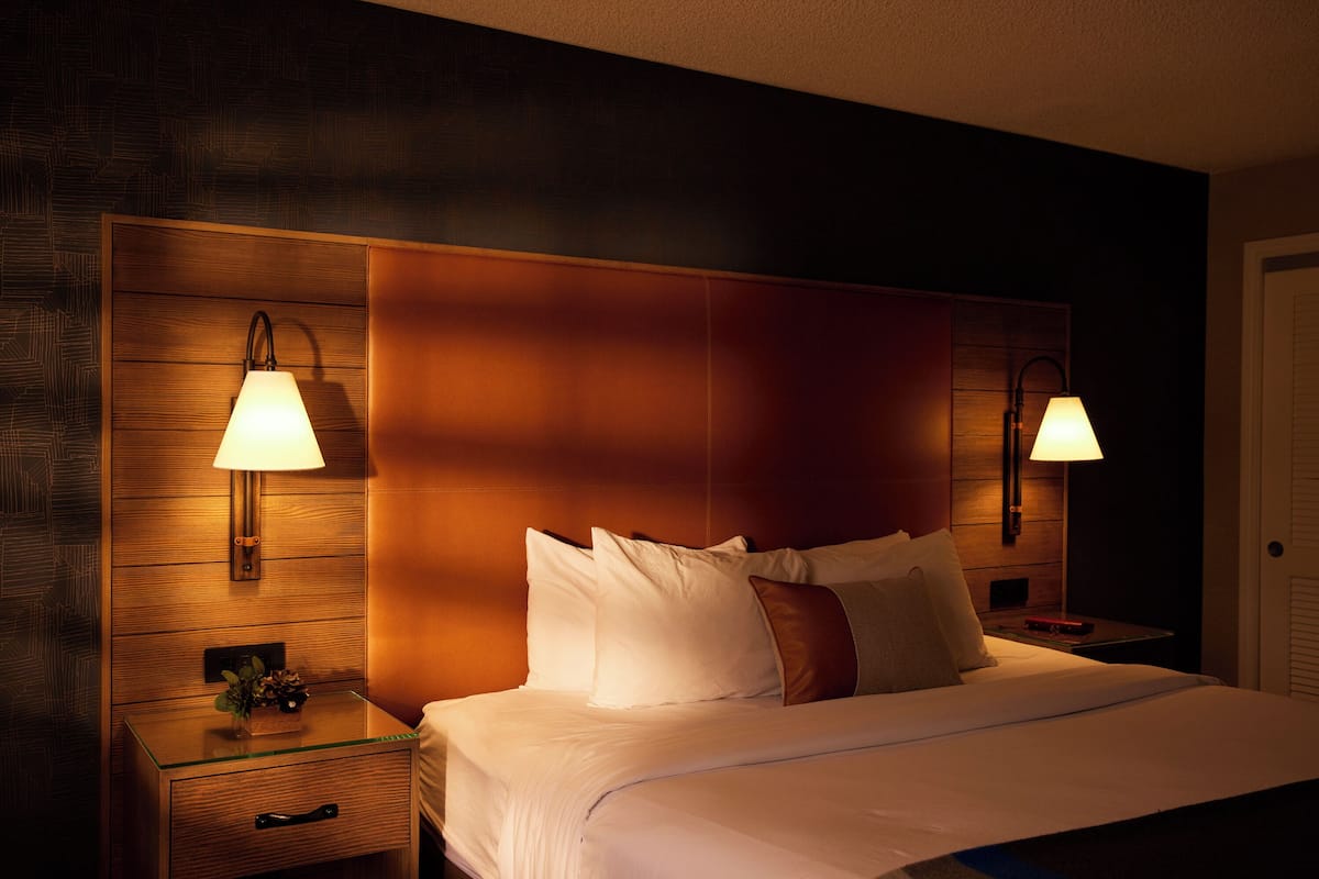 deluxe room, 1 king bed | premium bedding, desk, blackout curtains, iron/ironing board