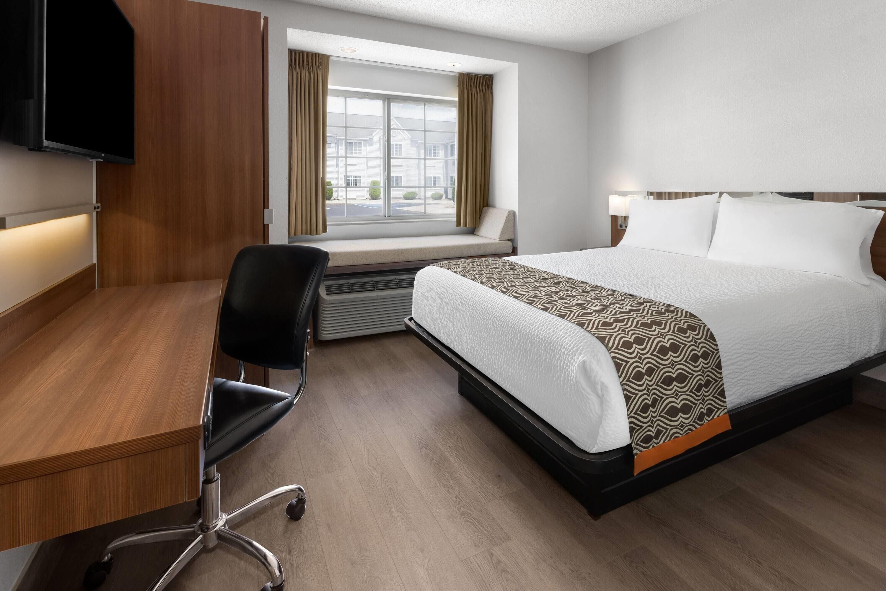 hypo-allergenic bedding, desk, blackout curtains, iron/ironing board