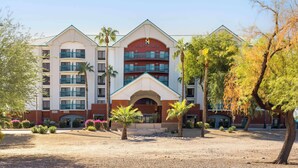 A multi-story hotel with a prominent entrance, balconies, and landscaped surroundings. - Hyatt Place Tempe Phoenix Airport (Tempe)