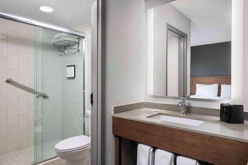 Designer toiletries, hair dryer, towels, soap