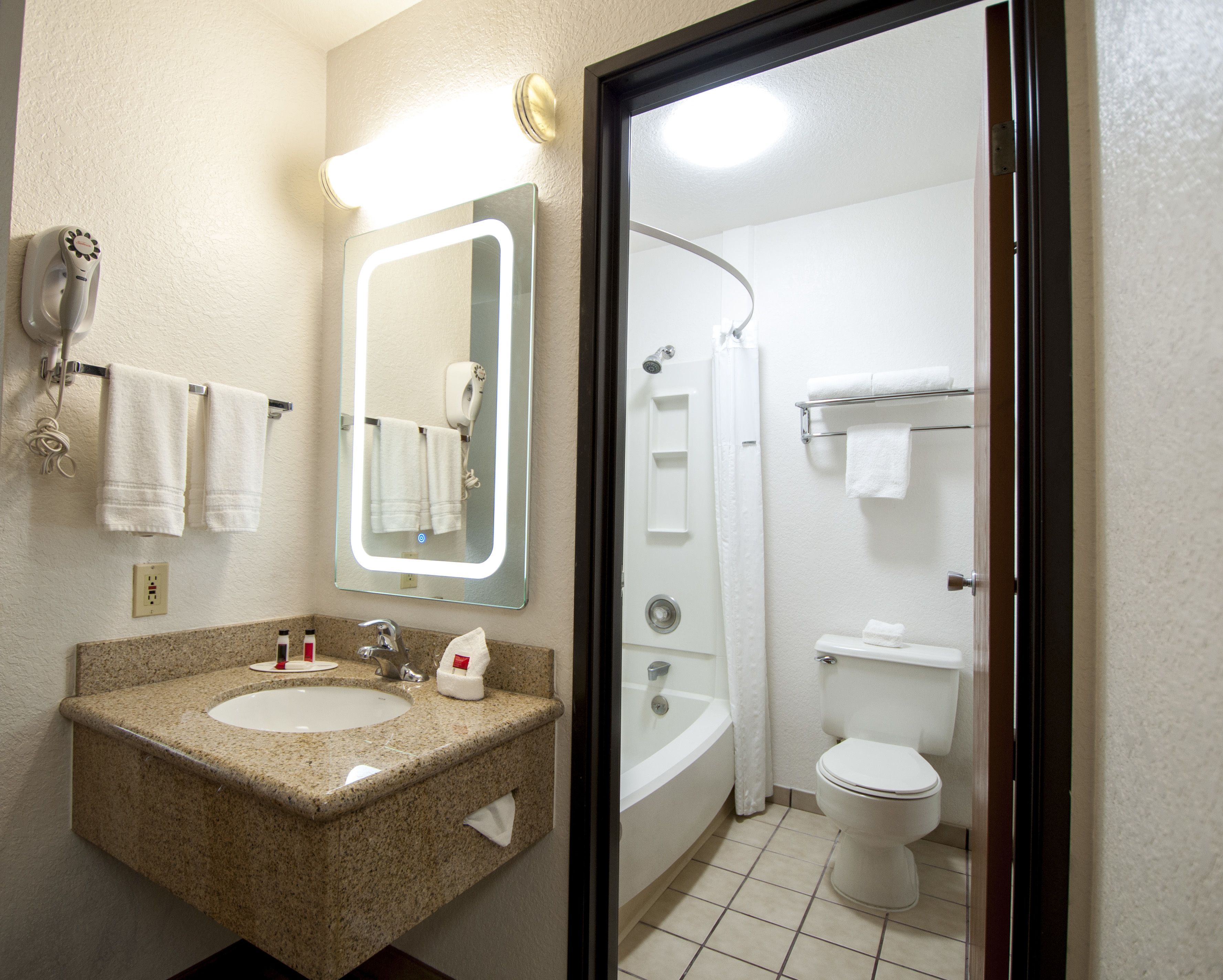 Combined shower/tub, hair dryer, towels, soap